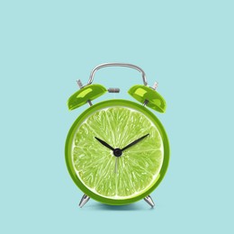 Image of Juicy lime on alarm clock dial against light blue background. Creative poster