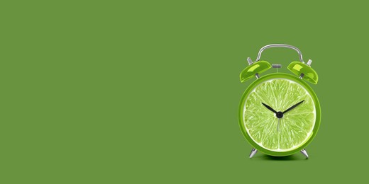 Image of Juicy lime on alarm clock dial against green background. Creative poster with space for text, banner design