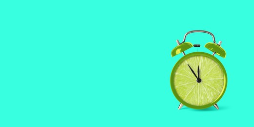 Image of Juicy lime on alarm clock dial against turquoise background. Creative poster with space for text, banner design