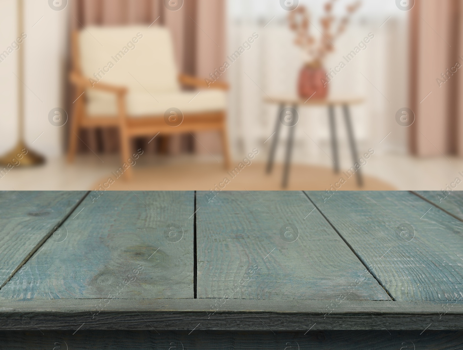 Image of Empty turquoise wooden table near armchair, side table and window with curtains. Space for design