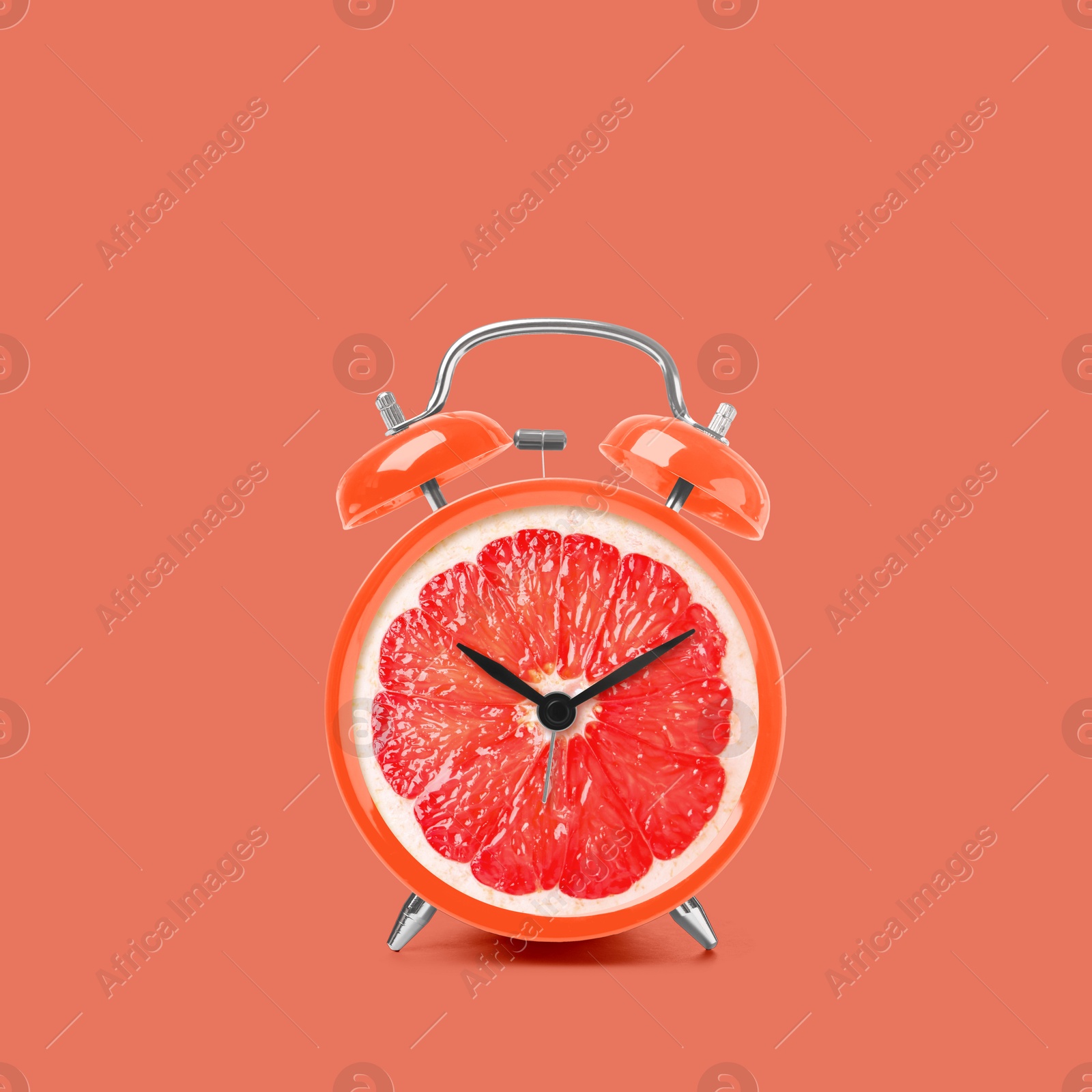 Image of Juicy grapefruit on alarm clock dial against dark coral background. Creative poster