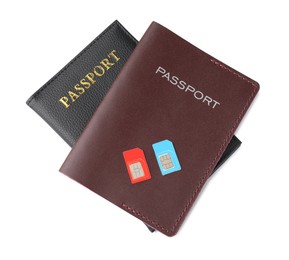 Photo of Passports and SIM cards isolated on white, top view