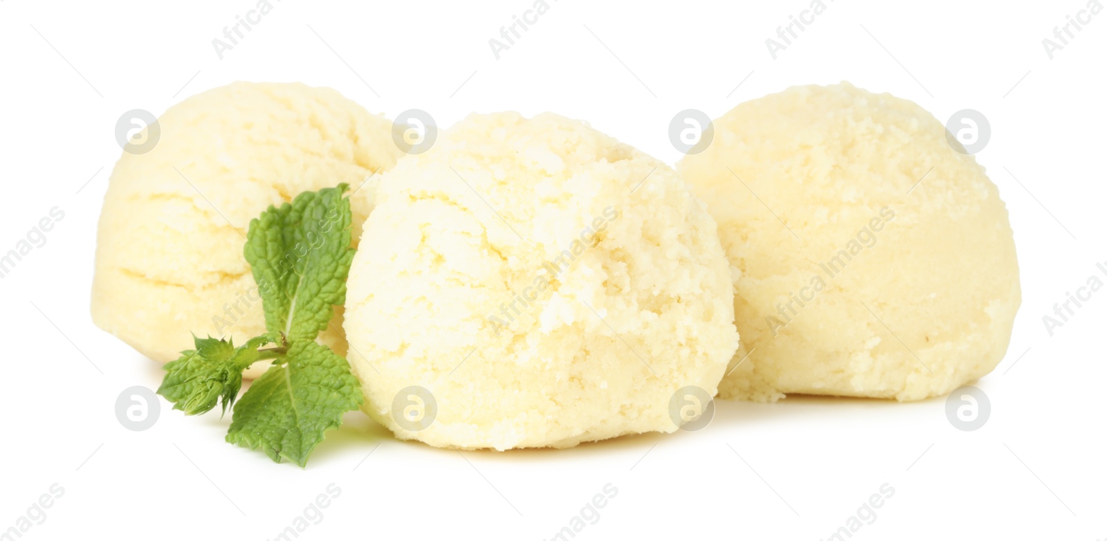 Photo of Scoops of melon sorbet and mint isolated on white