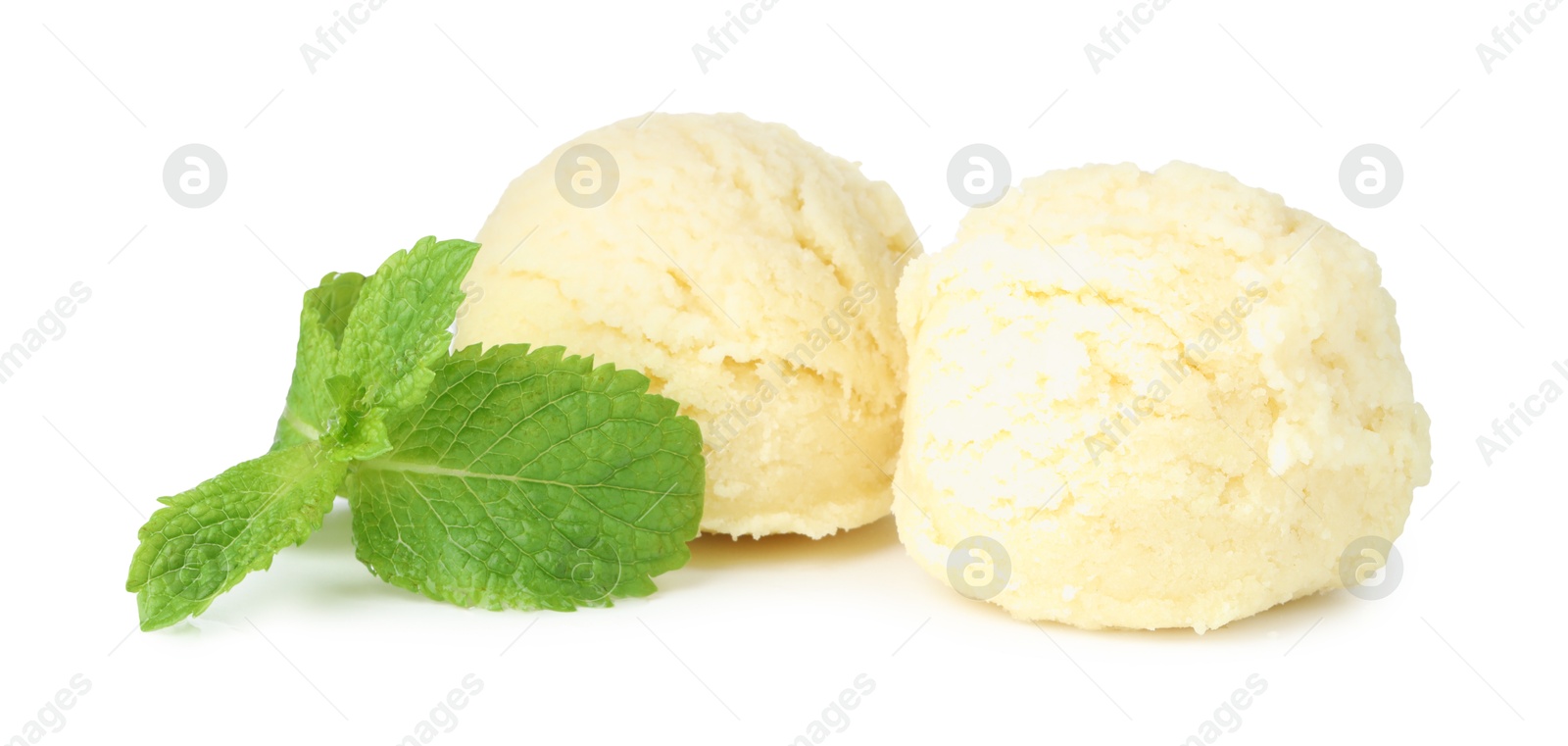 Photo of Scoops of melon sorbet and mint isolated on white