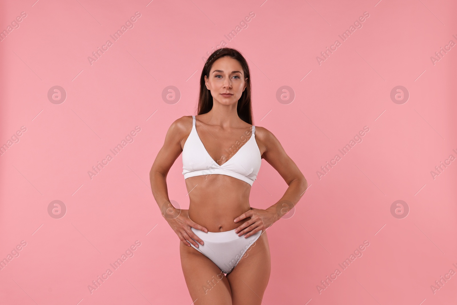 Photo of Beautiful woman with perfect skin on pink background. Body care