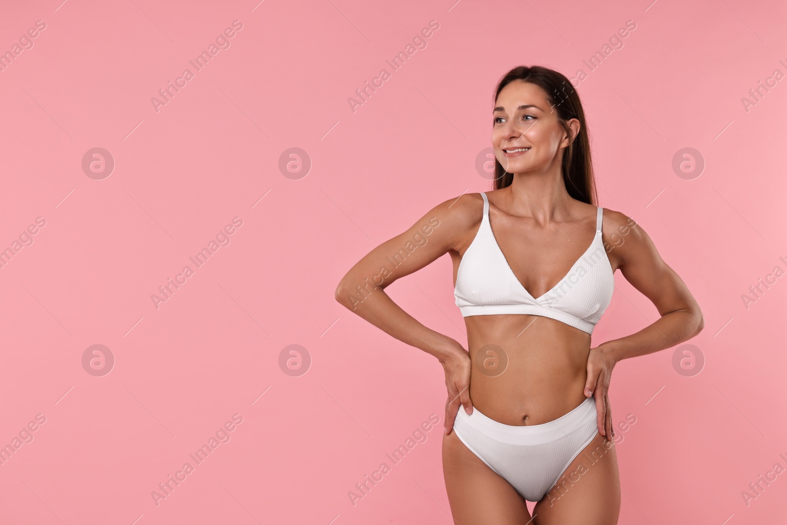 Photo of Smiling woman with perfect skin on pink background, space for text. Body care