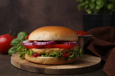 Delicious vegan burger with chickpea cutlet on wooden table