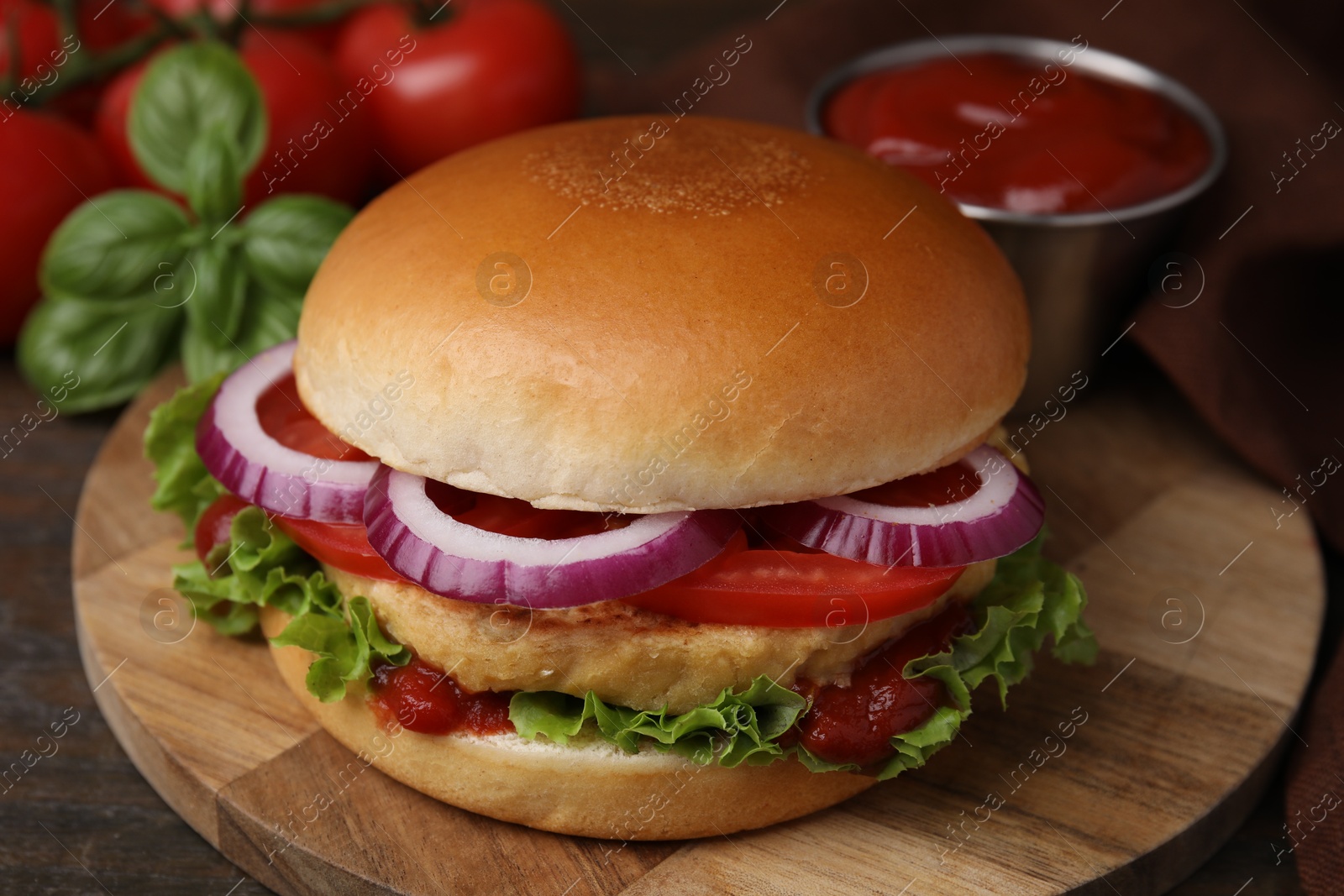 Photo of Delicious vegan burger with chickpea cutlet on wooden table, closeup