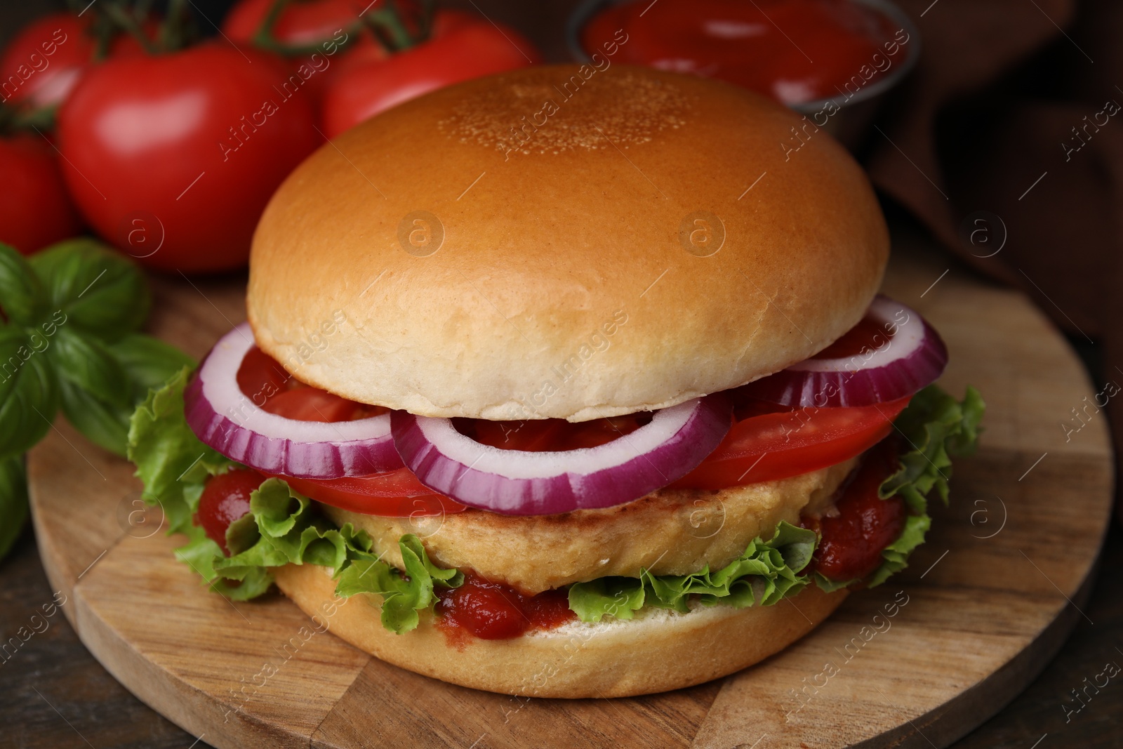 Photo of Delicious vegan burger with chickpea cutlet on wooden table, closeup