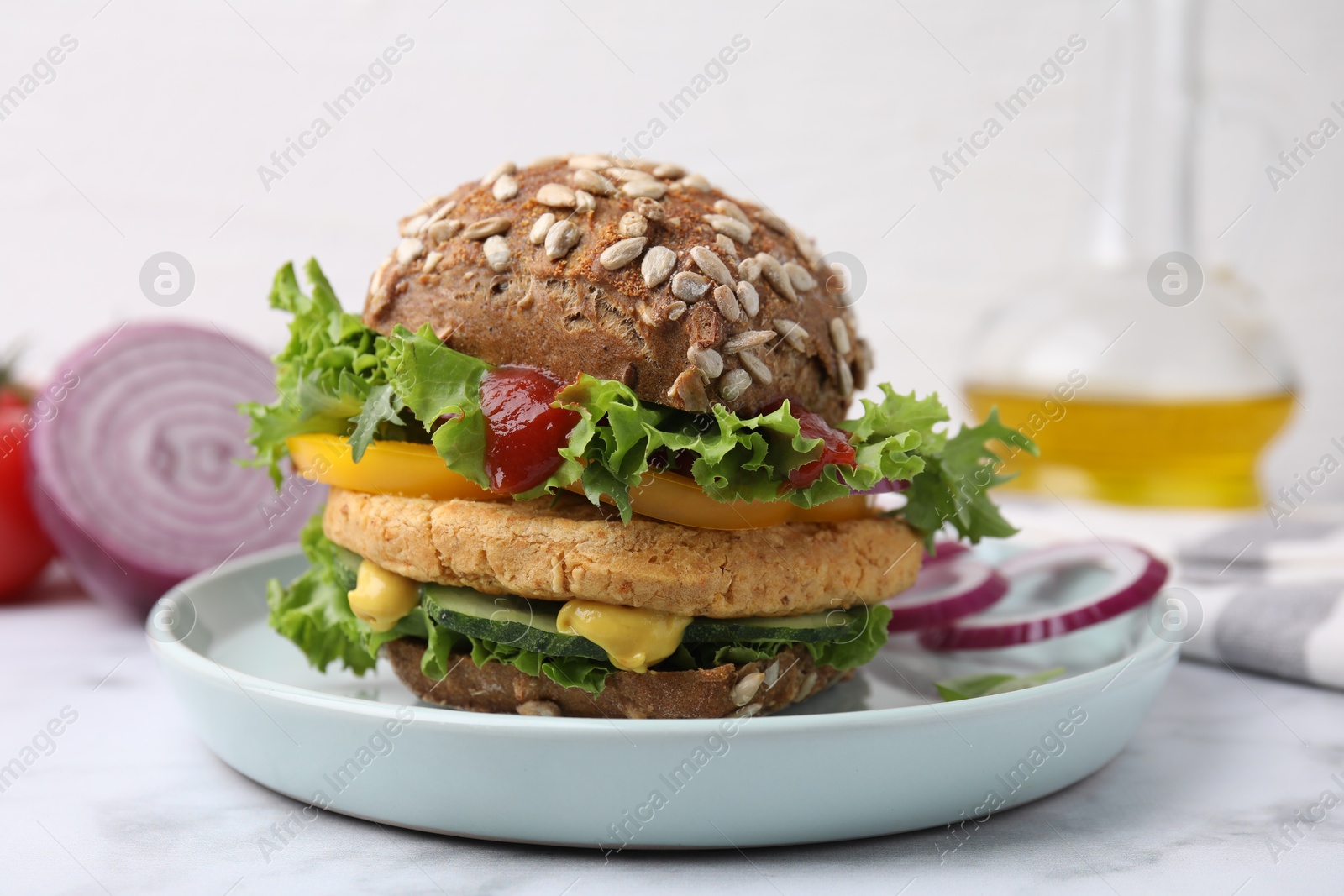 Photo of Delicious vegan burger with chickpea cutlet on white marble table, closeup