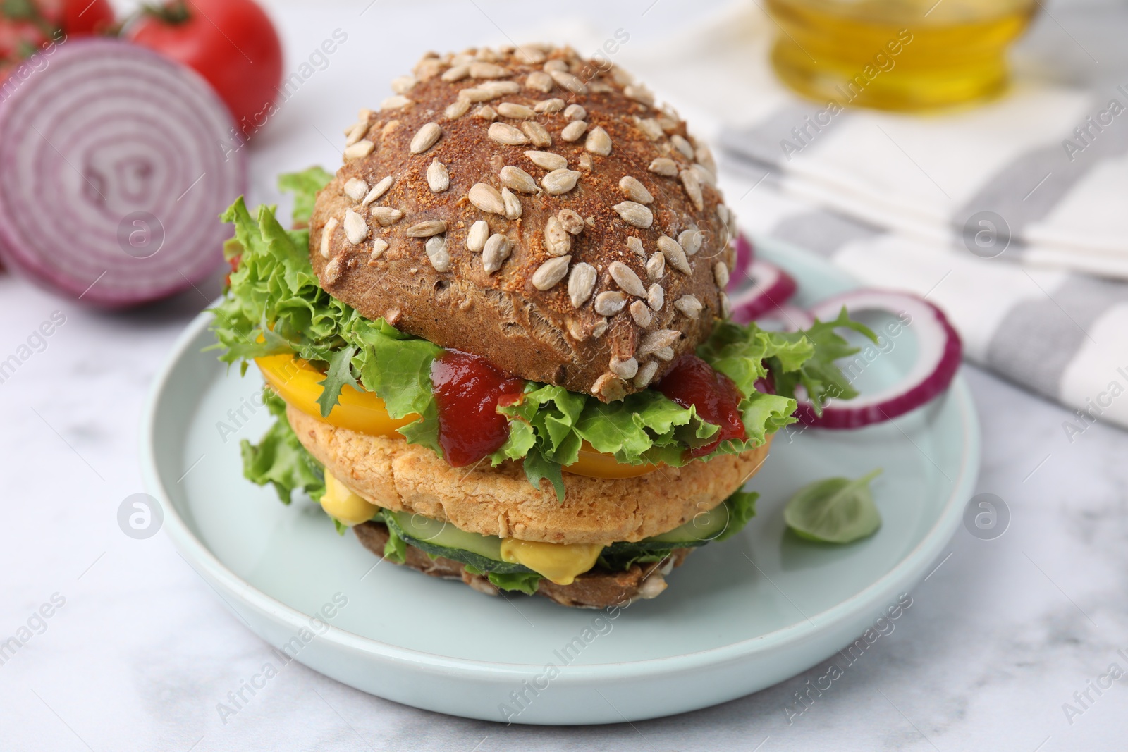 Photo of Delicious vegan burger with chickpea cutlet on white marble table, closeup