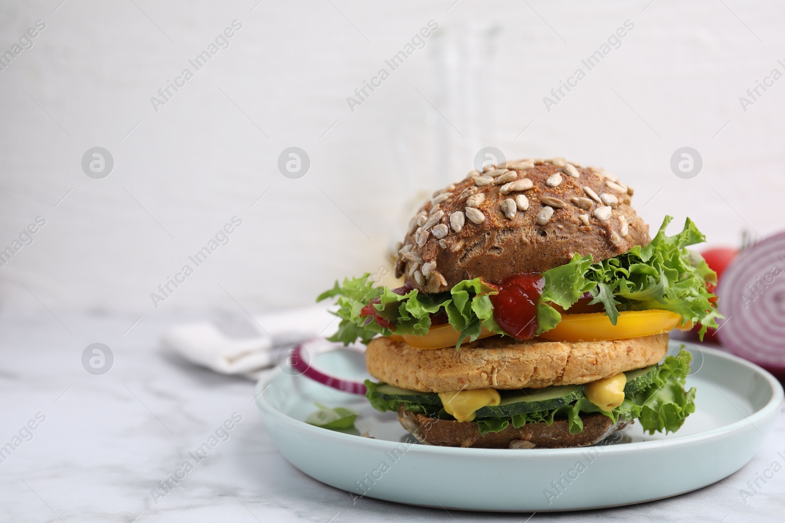 Photo of Delicious vegan burger with chickpea cutlet on white marble table. Space for text