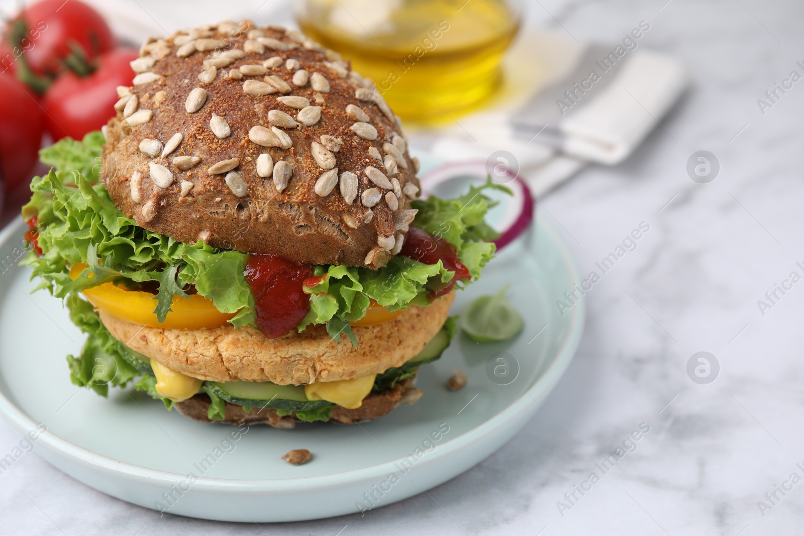 Photo of Delicious vegan burger with chickpea cutlet on white marble table, closeup