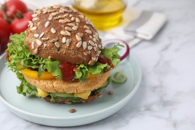 Photo of Delicious vegan burger with chickpea cutlet on white marble table, closeup