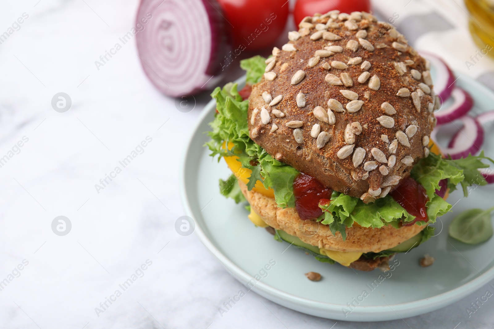 Photo of Delicious vegan burger with chickpea cutlet on white marble table, closeup. Space for text