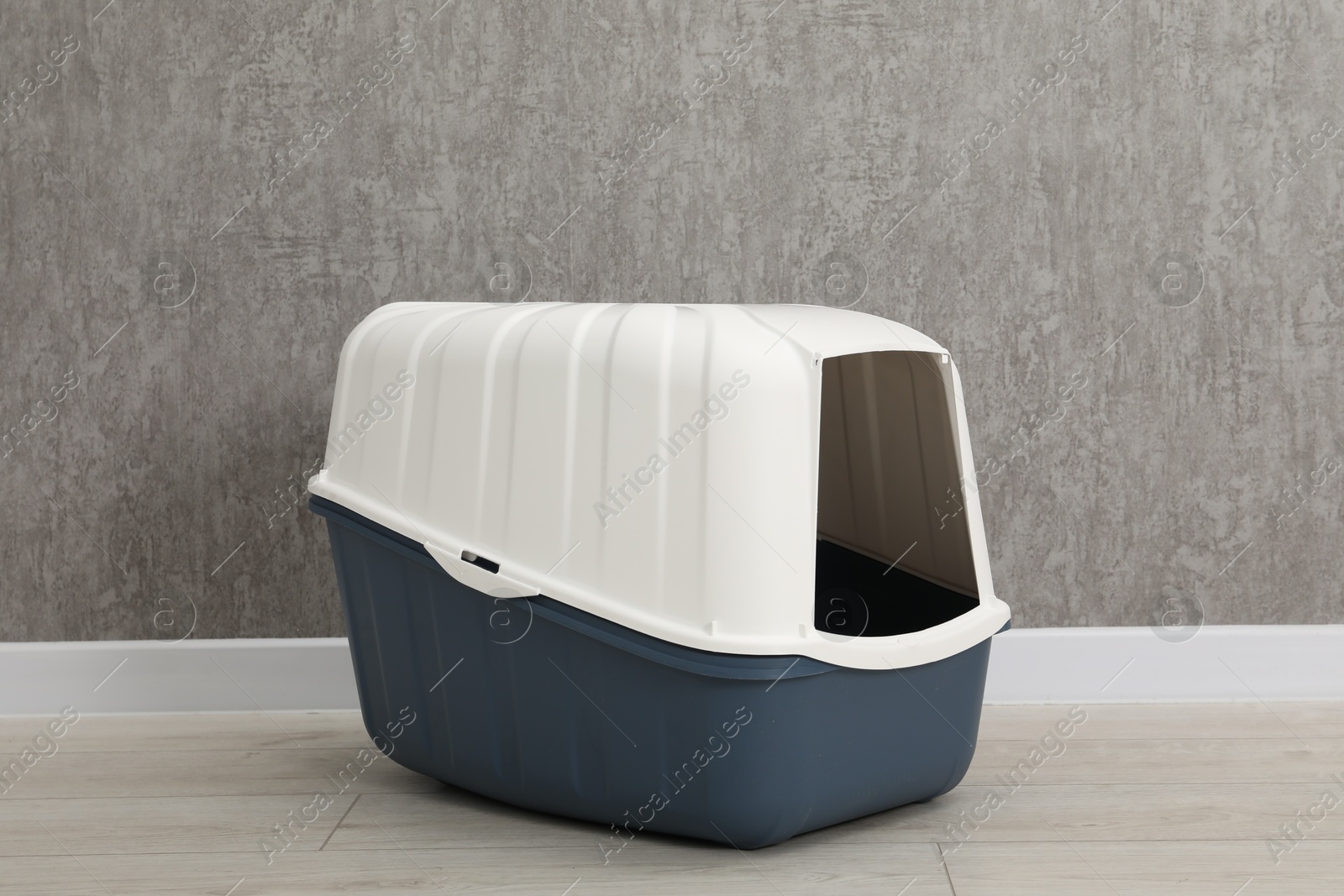 Photo of One cat litter box on floor indoors