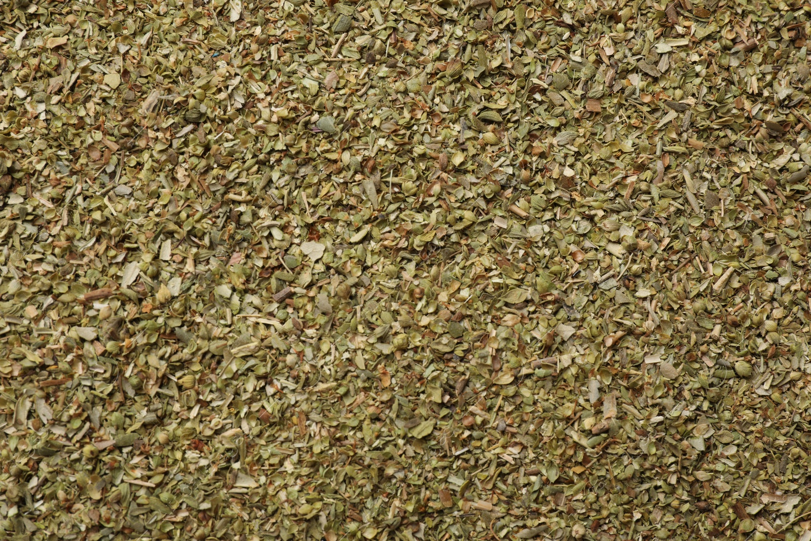 Photo of Dried oregano as background, top view. Aromatic herb