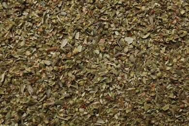 Photo of Dried oregano as background, top view. Aromatic herb