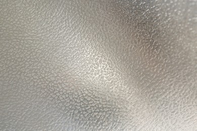 Photo of Shiny silver surface as background, closeup view