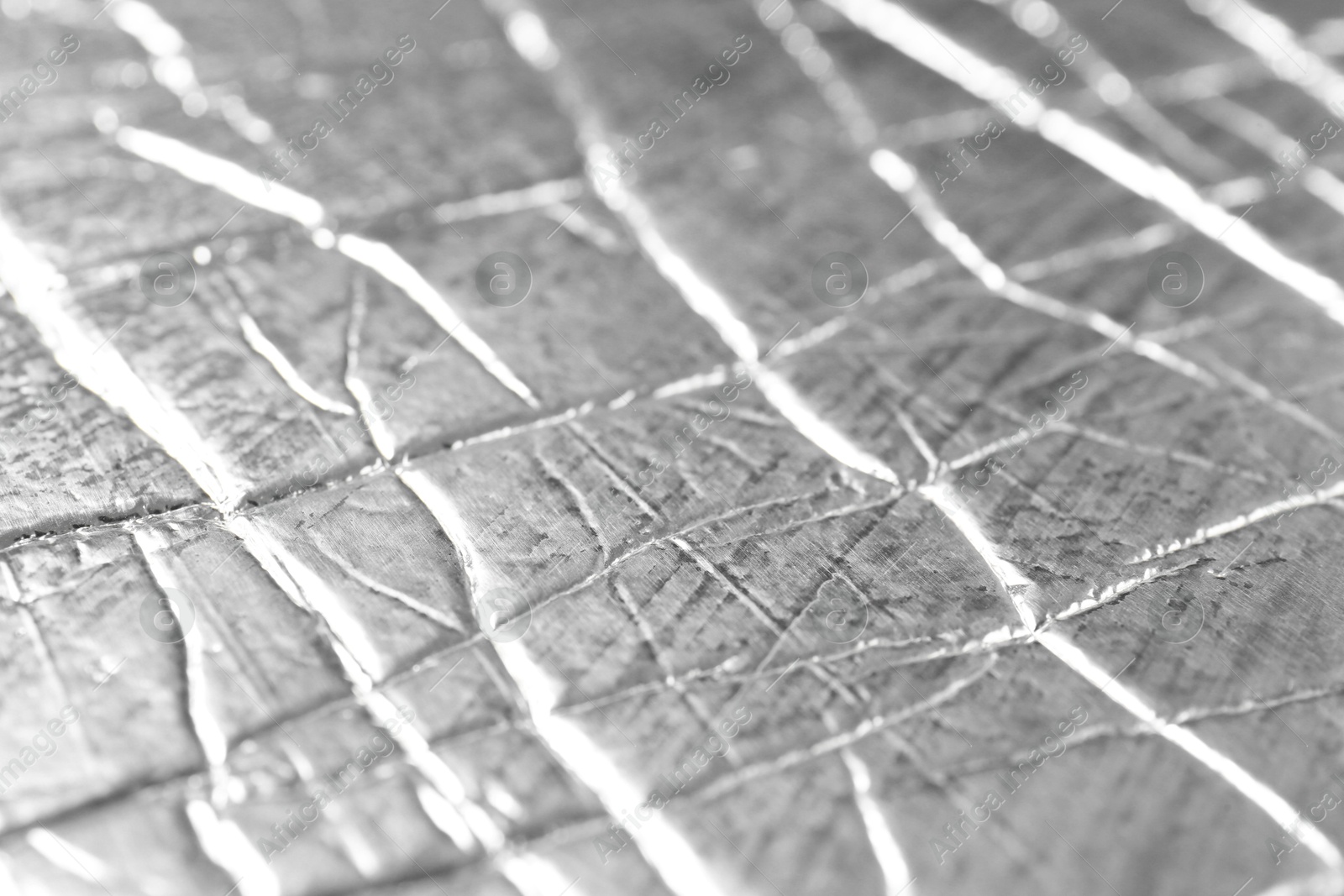 Photo of Shiny silver surface as background, closeup view