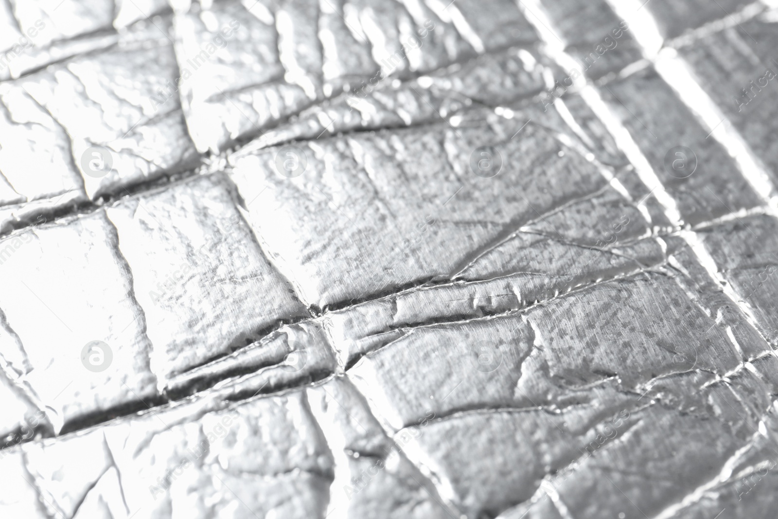 Photo of Shiny silver surface as background, closeup view