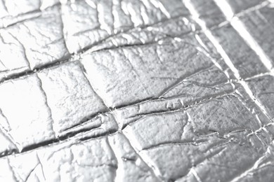 Photo of Shiny silver surface as background, closeup view