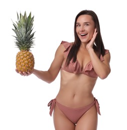 Attractive woman in bikini with fresh pineapple on white background