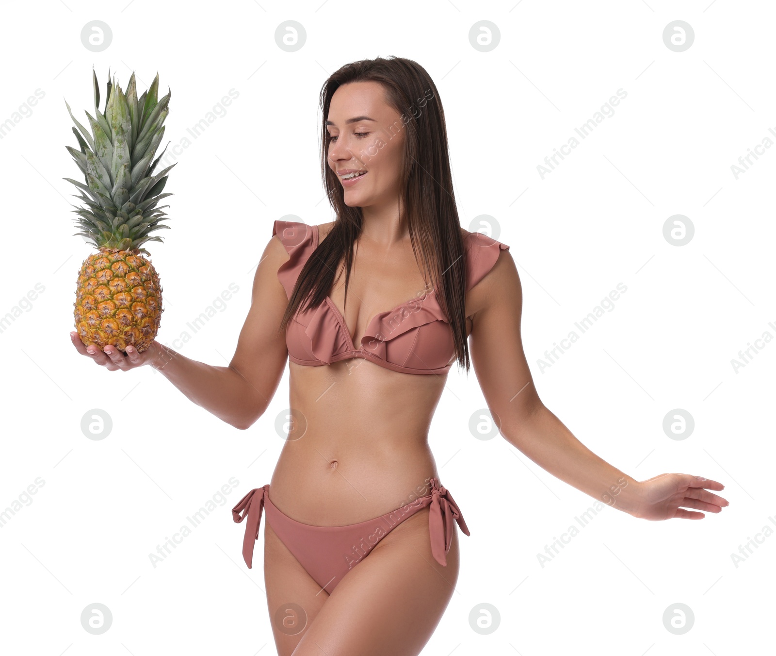 Photo of Attractive woman in bikini with fresh pineapple on white background