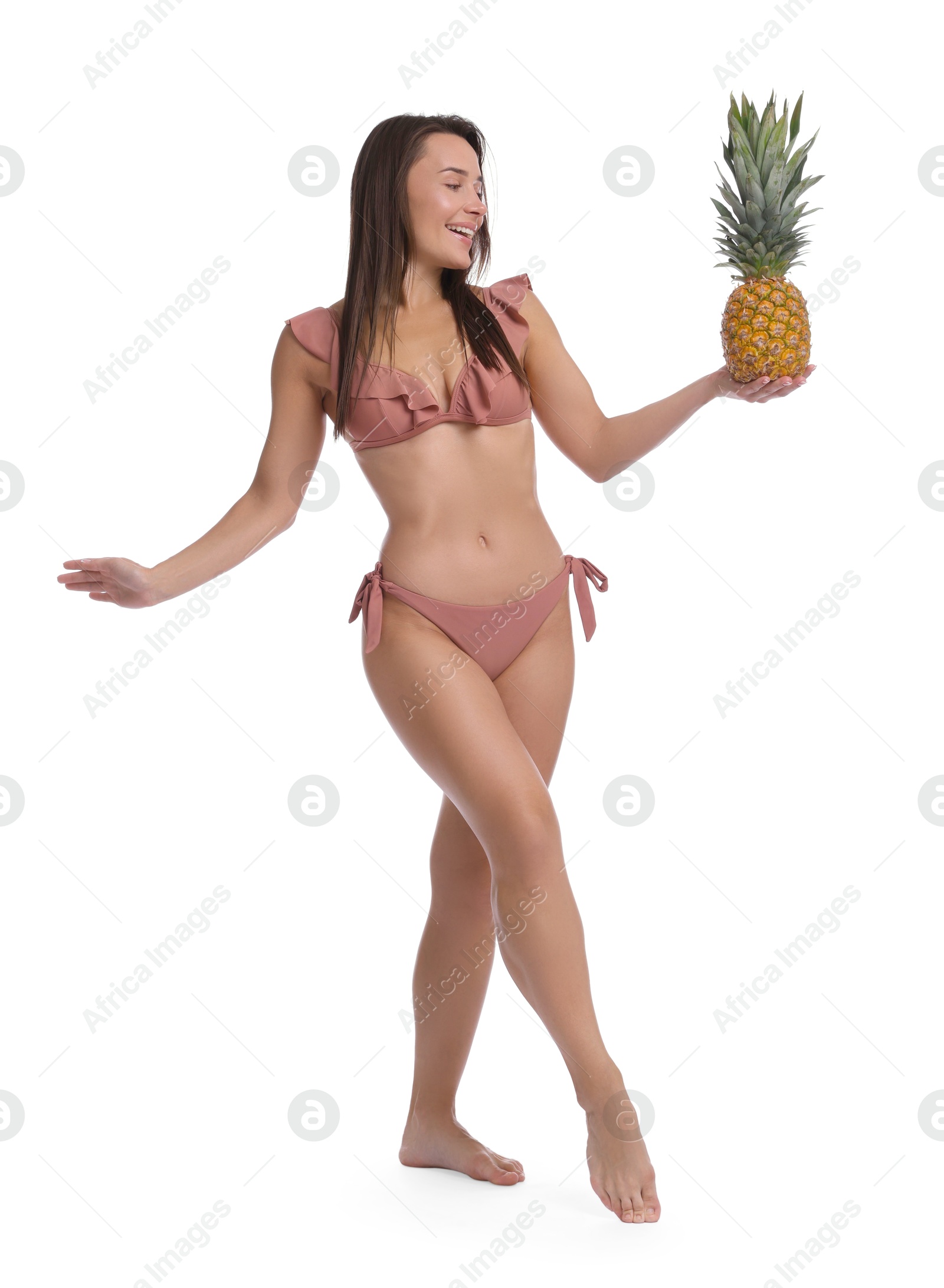 Photo of Woman in bikini with fresh pineapple on white background