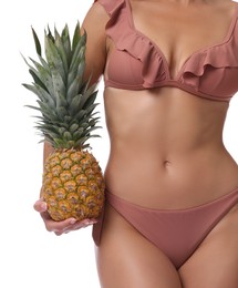 Photo of Woman in bikini with fresh pineapple on white background, closeup