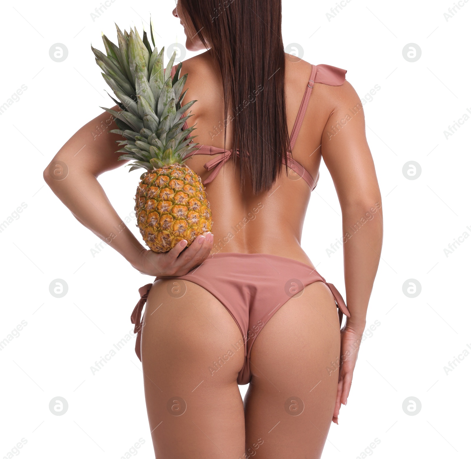 Photo of Woman in bikini with fresh pineapple on white background, closeup