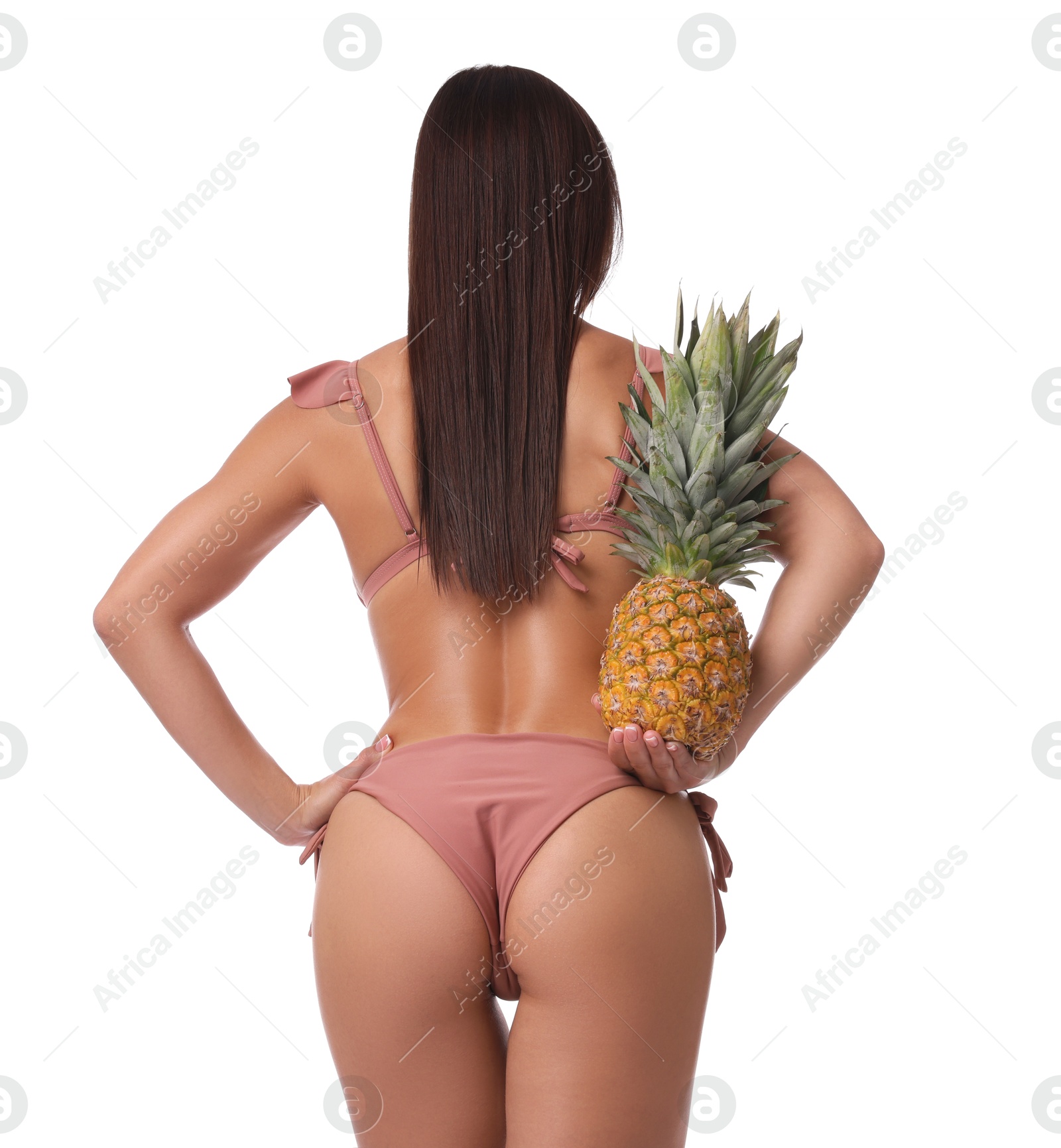 Photo of Woman in bikini with fresh pineapple on white background, back view