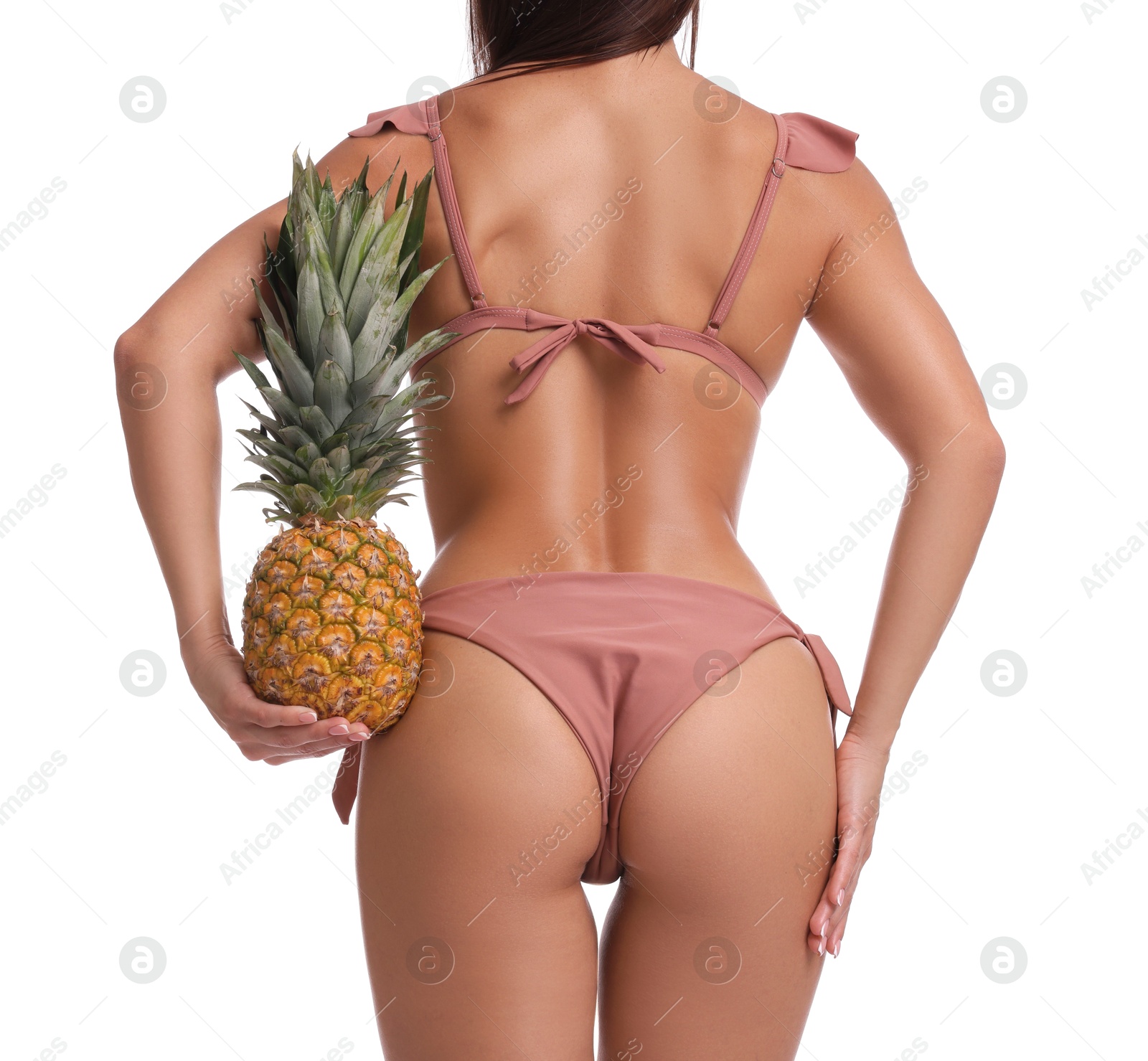 Photo of Woman in bikini with fresh pineapple on white background, closeup