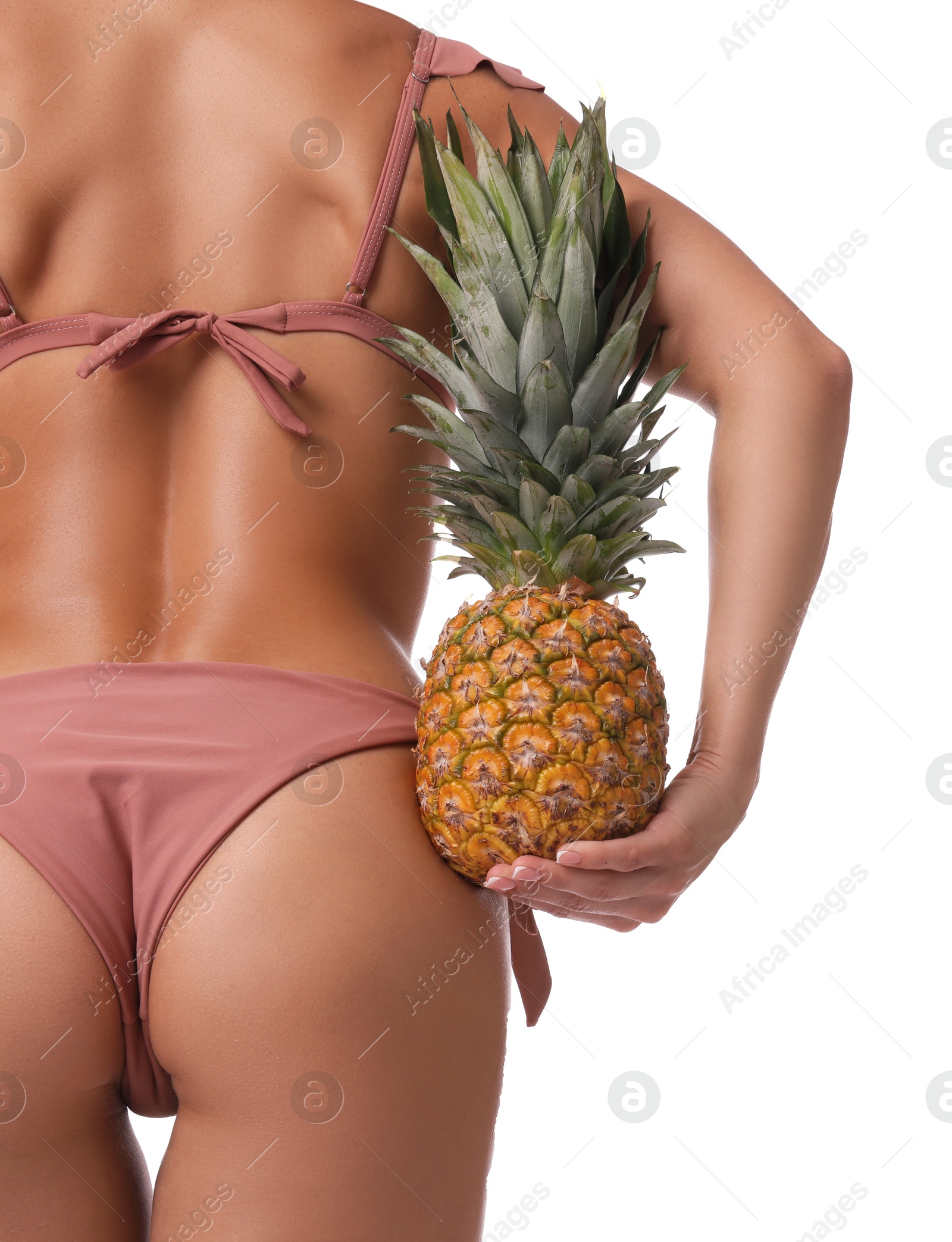 Photo of Woman in bikini with fresh pineapple on white background, closeup