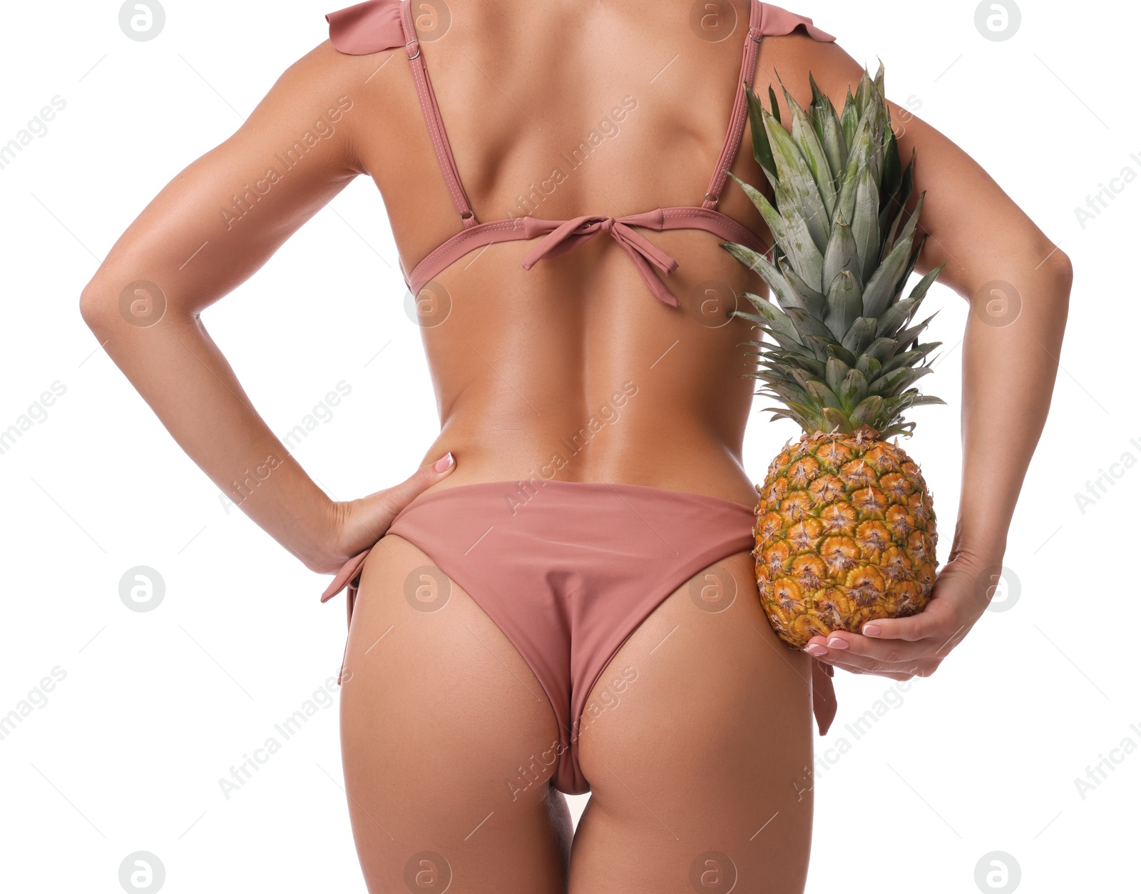 Photo of Woman in bikini with fresh pineapple on white background, closeup