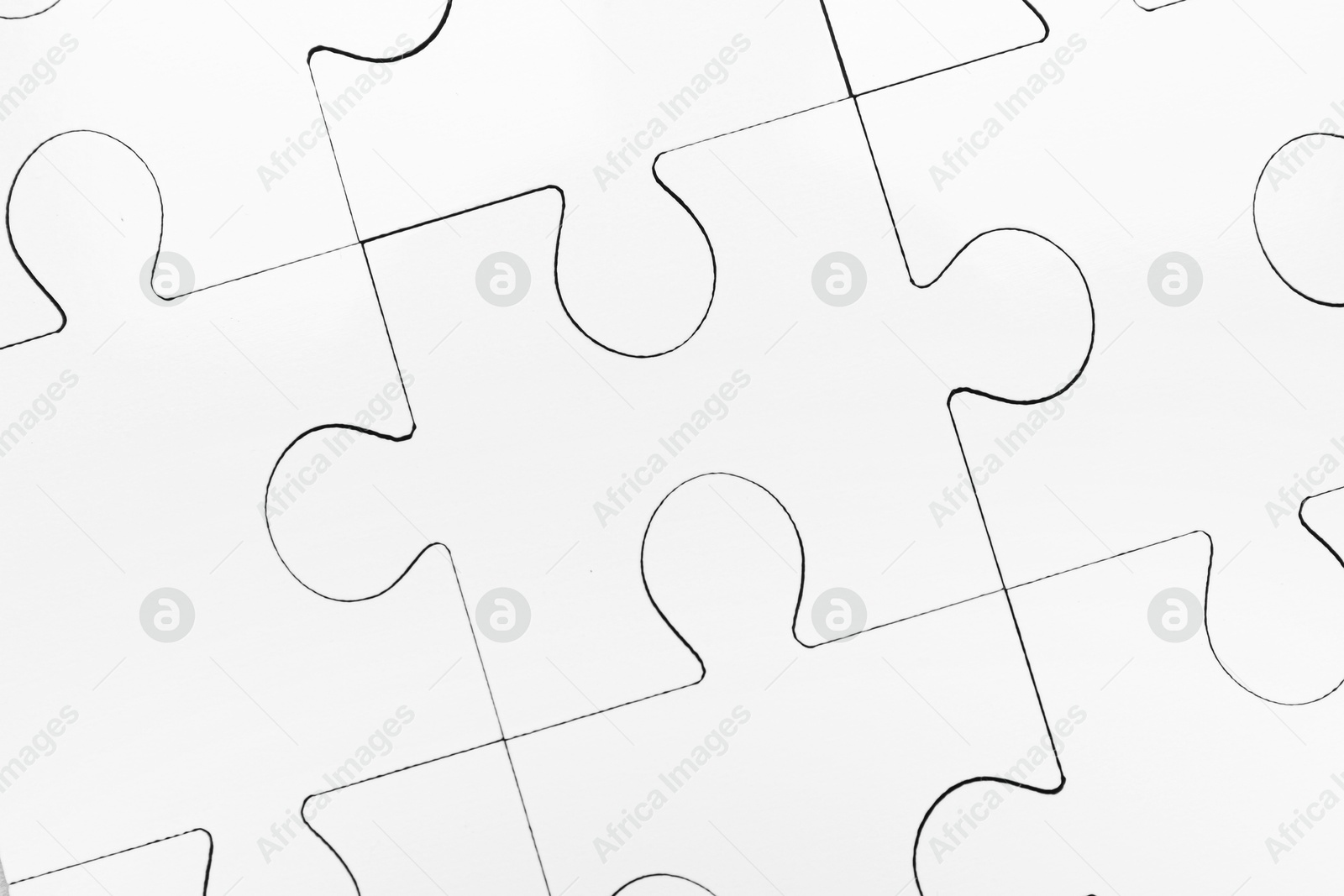 Photo of White puzzle as background, top view. Intellectual game