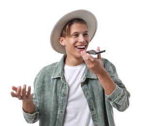 Photo of Young man in hat recording voice message via smartphone on white background