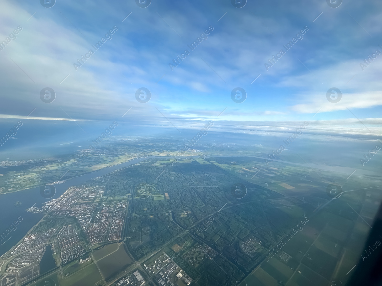 Photo of Picturesque view of city through plane window during flight