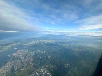 Photo of Picturesque view of city through plane window during flight