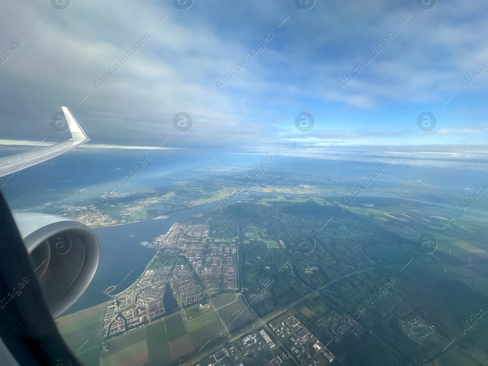 Photo of Picturesque view of city through plane window during flight