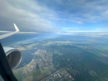 Photo of Picturesque view of city through plane window during flight