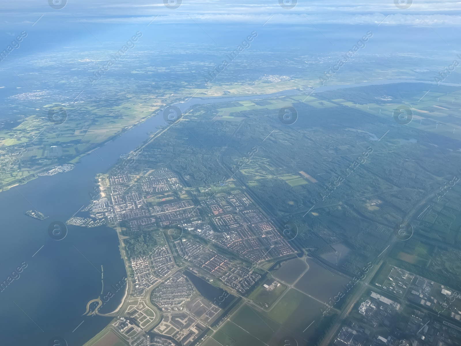 Photo of Picturesque view of city through plane window during flight