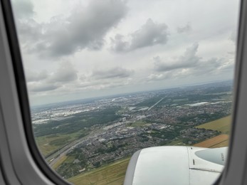 Photo of Picturesque view through plane window during flight