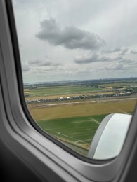 Photo of Picturesque view through plane window during flight