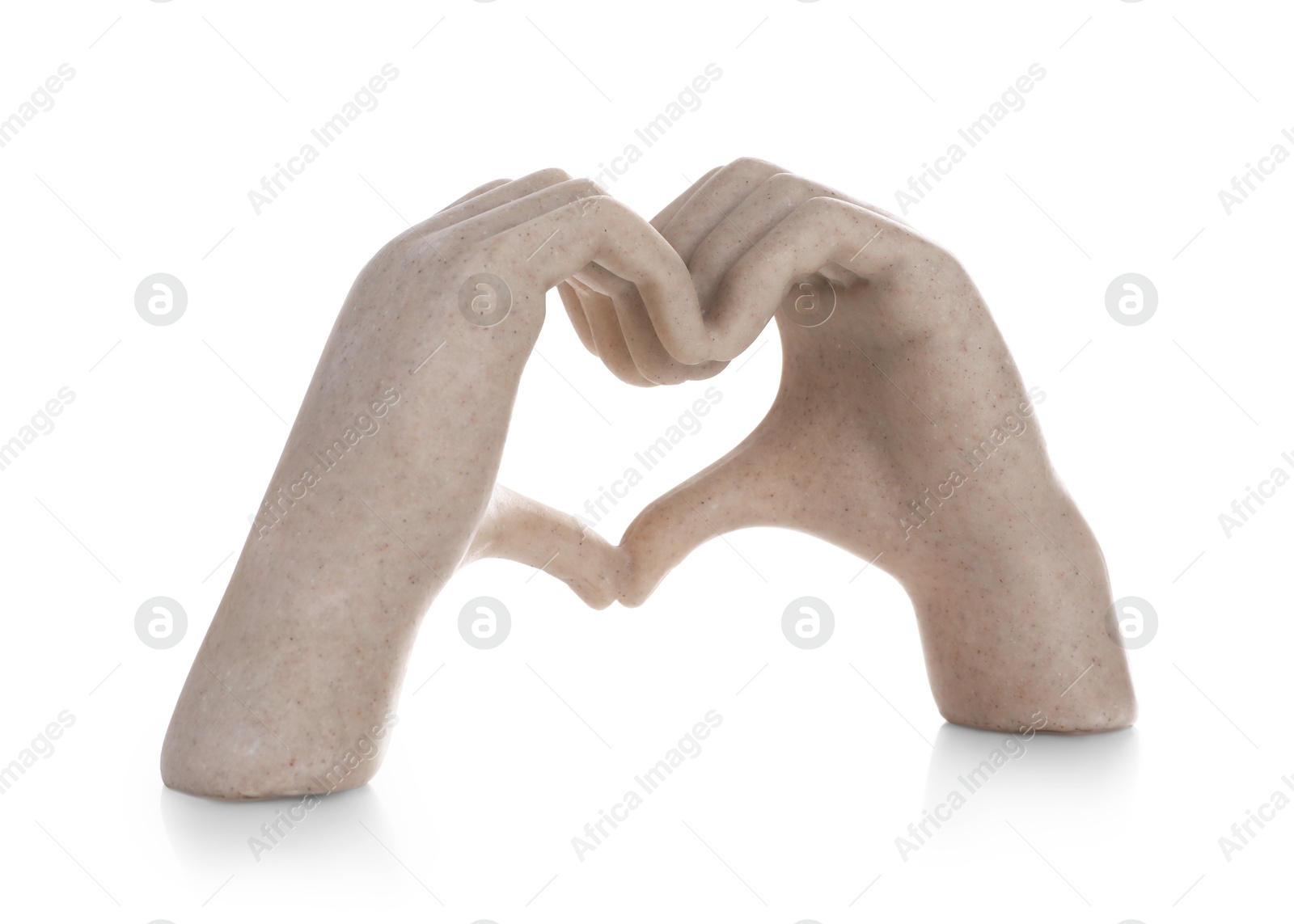 Photo of Decorative figure in shape of hands making heart isolated on white