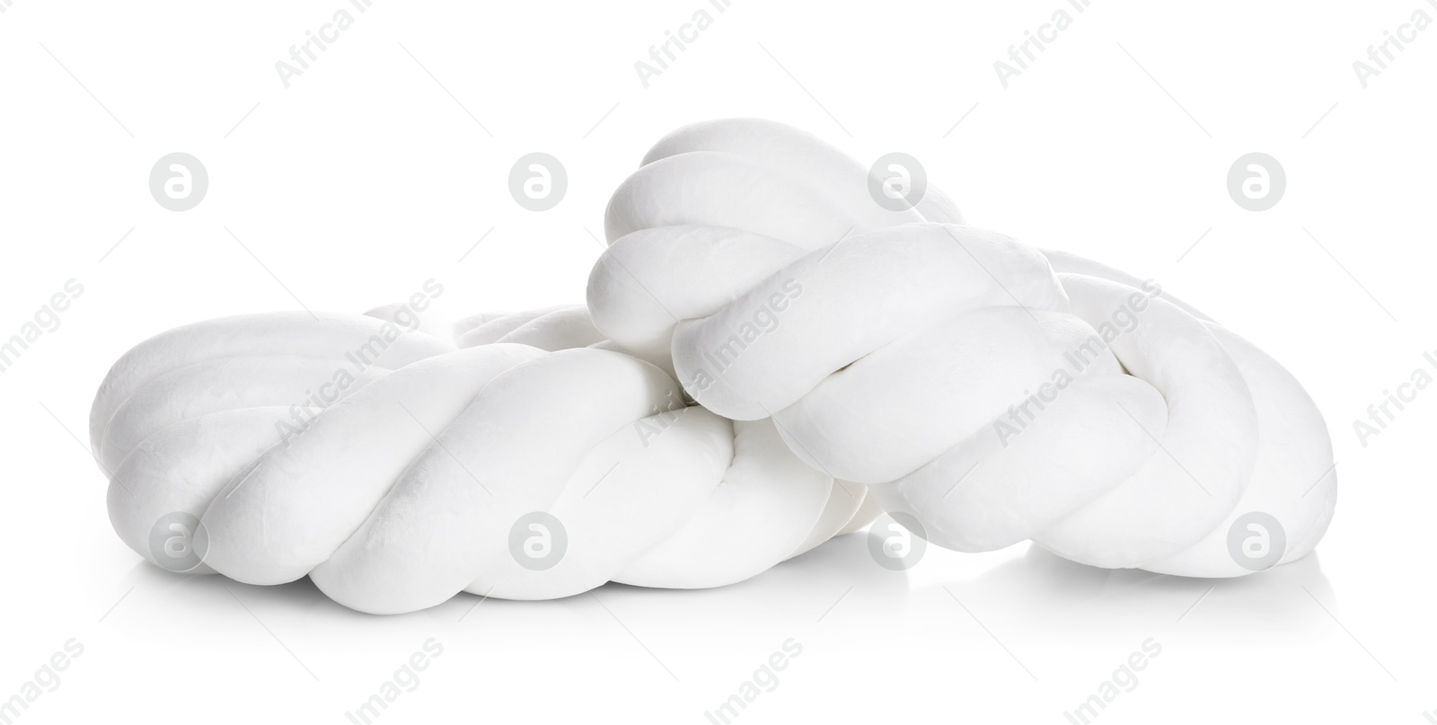 Photo of Cushions in shape of knot isolated on white