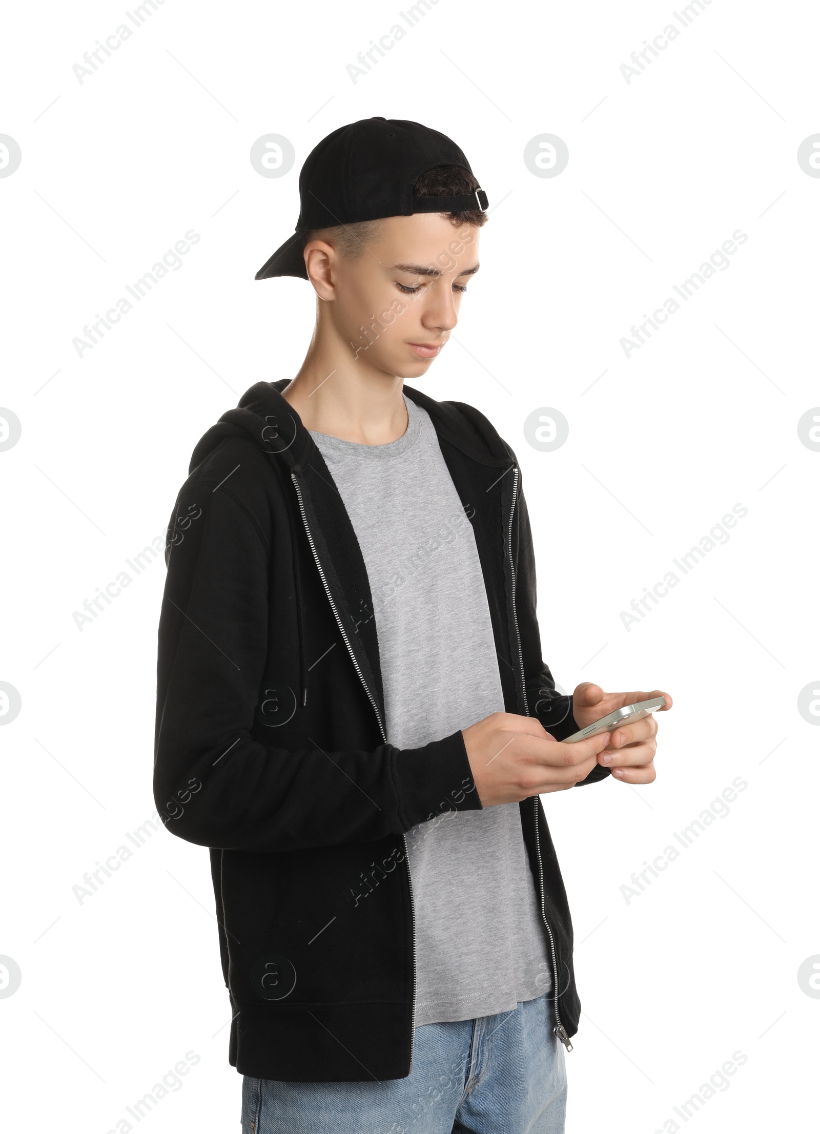 Photo of Portrait of teenage boy with phone on white background