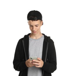 Portrait of teenage boy with phone on white background