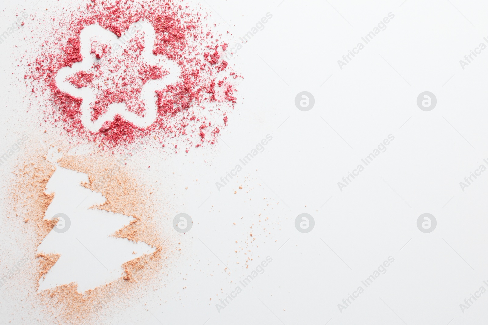 Photo of Christmas tree and star made of powder and blush on white background, top view. Space for text