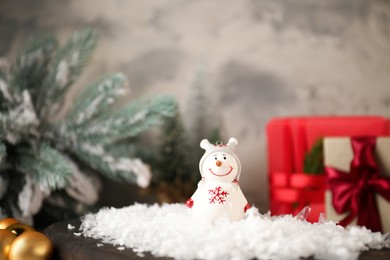 Photo of Funny snowman figure and Christmas decor on table